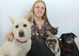 Staff member Adelle Abraitis with pets at Stretsville Animal Hospital