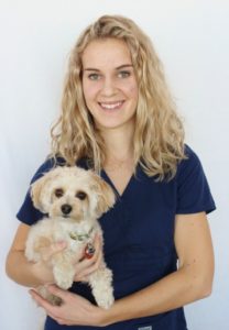 Staff member Lisa DeBoer with pet dog at Stretsville Animal Hospital